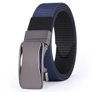 Close-up of navy blue nylon belt strap with matte gunmetal automatic buckle detail