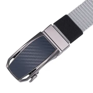 Close-up of gunmetal automatic buckle with carbon fiber texture and grey nylon belt