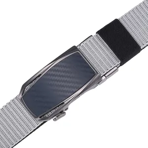 Close-up of men's nylon belt with gunmetal automatic buckle and carbon fiber inlay