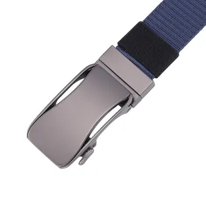 Detail of dark blue nylon belt featuring a gunmetal matte automatic buckle and elastic loop