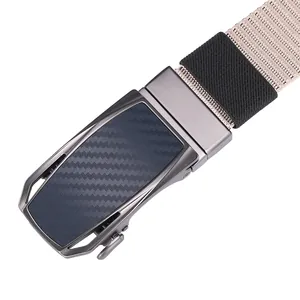 Detail of khaki nylon belt buckle with carbon fiber texture and gunmetal finish