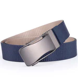Detail of blue woven nylon tactical belt showing alloy buckle and reversible dual-tone strap
