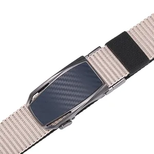 Close-up of beige woven nylon belt with dark grey metal automatic buckle and carbon fiber