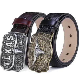Vintage western cowboy leather belts with embossed bull head buckles in black and brown