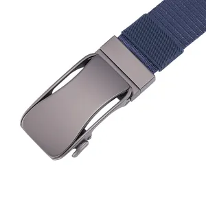 Close-up of matte gray automatic buckle with textured navy blue woven canvas belt strap