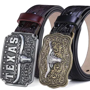 Western cowboy leather belt set with embossed patterns and silver longhorn bull buckles