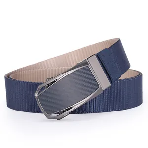 Detail of navy blue and beige nylon belt with carbon fiber texture automatic buckle
