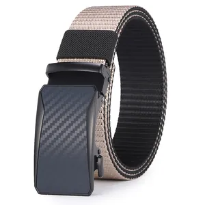 Detail of men's automatic buckle belt featuring carbon fiber texture and nylon webbing