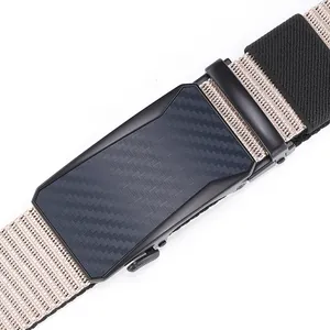 Detail of khaki nylon tactical belt with carbon fiber texture automatic buckle