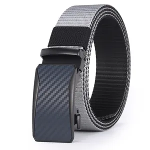 Detail showing the gray and black nylon woven texture and carbon fiber buckle of tactical belt