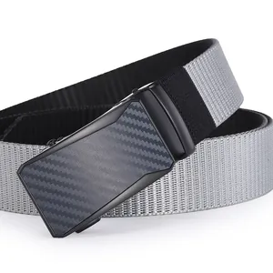 Detailed close-up of a men's gray woven belt with a black automatic carbon fiber buckle