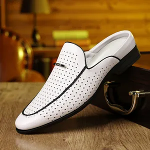 Detailed macro view of white perforated leather upper with black braided trim and metal buckle