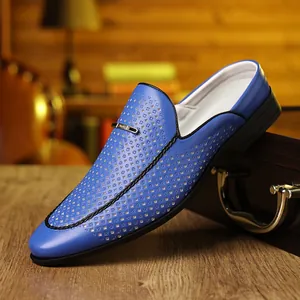 Detail of blue perforated leather mule for men featuring breathable texture and metal buckle