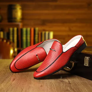 Detail view of red hollow leather mule sandals with gold bar and breathable mesh design