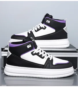 Detailed view of high-top sneakers with black, white, and purple patchwork and thick rubber soles