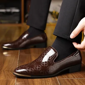 Brown patent leather loafers with star embossing and metallic toe cap for formal wear