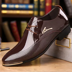 Detailed side view of brown leather business shoe with gold V-shape trim and honeycomb texture
