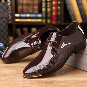 Macro shot of dark brown leather dress shoe with honeycomb texture and gold metal logo detail