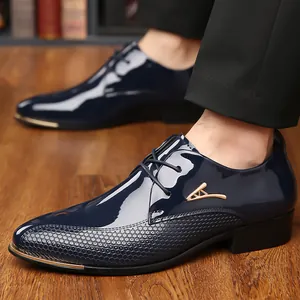 Detail of navy blue patent leather dress shoe with metallic gold toe and honeycomb texture