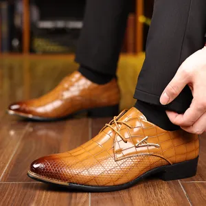 Macro detail of brown crocodile embossed dress shoe with gold metal buckle and tip