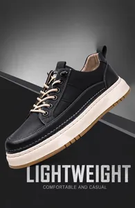 Détail latéral de baskets homme en cuir noir avec semelle épaisse et coutures contrastées