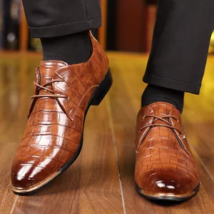 Brown alligator embossed leather business shoes for men with gold metal tip detailing