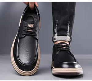 Close-up of men's black leather casual shoes with lychee grain and thick rubber sole