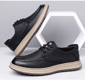 Close-up of black litchi grain leather men's casual shoes with thick beige cushioned soles