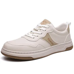 Zapatillas minimalistas blancas y beige para hombre con logo de moda en vista lateral