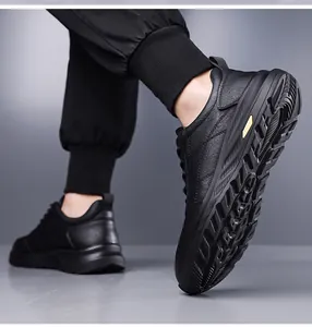 Macro shot of black leather sneaker featuring a non-slip thick sole with yellow accents