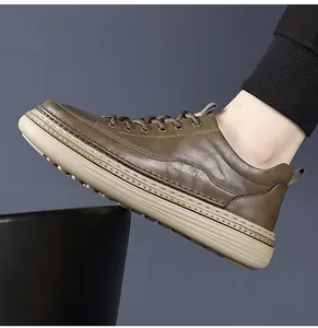 Side view of men's dark brown leather sneakers with beige thick soles and lace-up detail