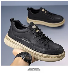 Detail of black low-top casual leather shoe with thick rubber sole and stylish lettering