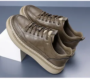 Detailed side view of brown leather casual sneakers featuring textured uppers and thick soles