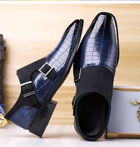 Detail of blue crocodile pattern and black suede leather double monk strap shoes
