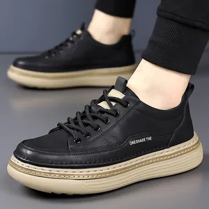 Men's stylish black leather sneakers with thick khaki rubber sole in profile view
