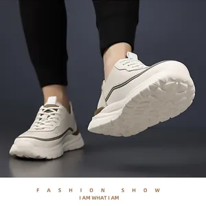 Detail view of cream-colored thick sole with wave patterns on high-quality dad sneakers