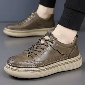Men's stylish dark brown leather sneakers with thick rubber soles on feet