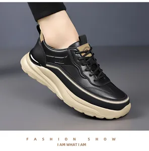 Detail view of black leather sneakers with SPORT relief and thick khaki soles