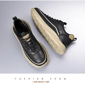 Detailed view of men's chunky sneakers featuring contrast panels and textured stitching