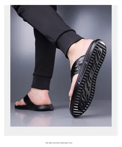 Detail view of the crocodile pattern leather and thick anti-slip rubber sole of men's flip flops