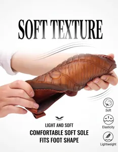 Brown leather shoe showing a highly flexible rubber sole being folded for durability