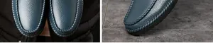 Primer plano detallado de zapatos de cuero azul marino con costuras hechas a mano