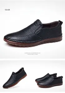 Detail view of black leather slip-on loafers for men with non-slip brown rubber soles