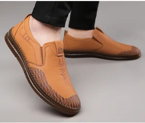 Macro side view of light brown slip-on leather shoes with anti-slip rubber texture sole