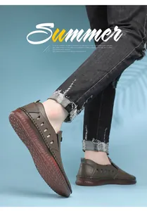 Close-up of men's hollow leather sandals with breathable laser-cut holes and non-slip rubber sole