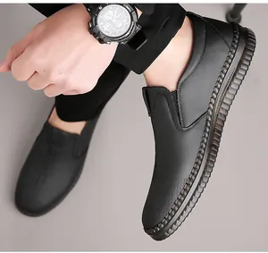 On-foot view of men's black leather slip-on loafers with durable non-slip rubber soles