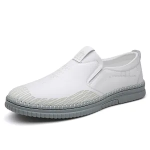 Men's slip-on white leather loafers with embossed pattern and soft non-slip rubber sole