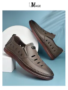 Detail view of brown men's hollow leather sandals with hand-stitched seams and breathable holes