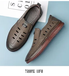 Close-up of men's hollow leather sandals with hand-stitched details and rubber soles