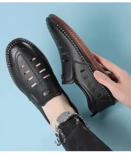 Detail of men's black leather sandals with cutout vents and durable rubber sole